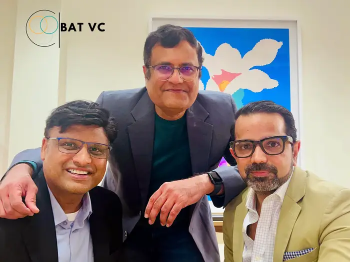 Founding team of BAT VC posing together in an office setting, showcasing leadership behind the venture capital firm with logo visible in the background.