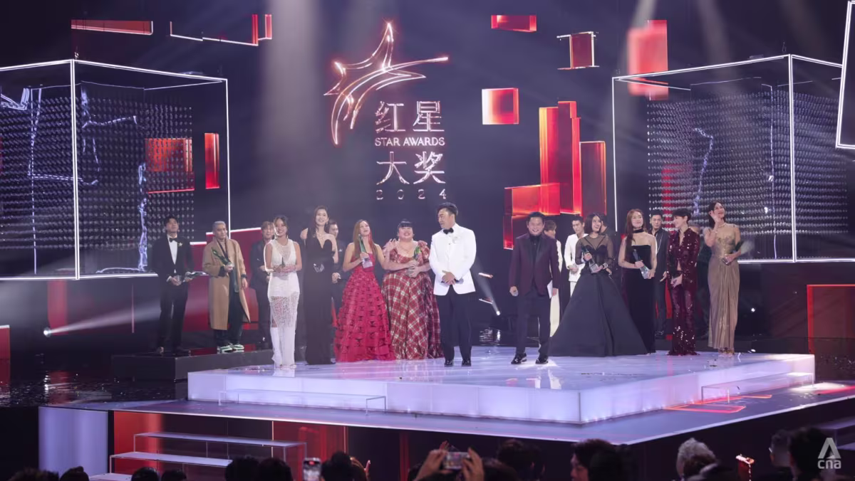 Singapore celebrities on stage at Star Awards 2024 ceremony, celebrating excellence in Mandarin television entertainment with dazzling red carpet fashion and live audience applause.